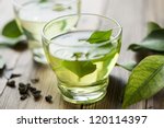 glass cup with fresh green tea