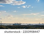 Small photo of Gothenburg, Sweden - september 18 2022: Container cranes loading Maribo Maersk at Skandiahamnen.