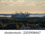 Small photo of Gothenburg, Sweden - september 18 2022: Container cranes loading Maribo Maersk at Skandiahamnen.