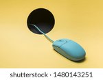 Wired mouse with cable passing through hole