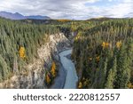 View of Kuskulana River from bridge above with fall colors, Wrangell St Elias National Park