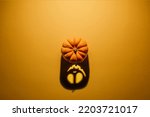 Small photo of Halloween background concept. Jack O pumpkin angry face shadow. Spooky smiling shadow of an orange pumpkin lantern top view close up, Halloween party design