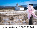 Small photo of Morleyville Alberta Canada, November 01 2021: The Mcdougal Memorial United Church at background with an every child matters teddy bear.