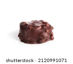 Isolated chocolate praline with hazelnut pieces. Closeup of one small non uniform chocolate truffle piece coated with dark chocolate. Selective focus.