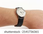 Small photo of puristic antique silver watch swiss made used worn wristwatch isolated elegant noble retro classic luxurious front view close up Macro rare pocketwatch with black leather bracelet band strap modern