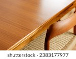 A Mid Century Teak Dining Table with four chairs from the 50s 60s Danish Design Vintage Dining solid wood Modern antique 50s 60s isolated on white wall in modern living room closeup side front view