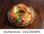 Small photo of Tortell de reis or king cake is a typical cake of Catalan and Occitan cuisine in the form of a ring , made of brioche dough, puff pastry and filled with ingredients such as marzipan, cream. Catalonia