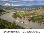 Panorama of Wachau valley (Unesco world heritage site) with ship on Danube river against Duernstein village in Lower Austria, Austria