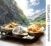 Small photo of Typical Scandinavian sandwiches against deep walley close the train journey Flamsbana between Flam and Myrdal in Aurland in Western Norway