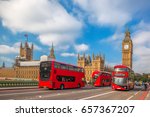 London with red buses against Big Ben in England, UK