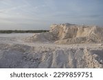 Small photo of Limestone quarry in the village of Chalk Hills, West-Kazakhstan region, the city of Uralsk. Lime quarry for the production of bricks. Piles of chalk stones.