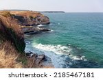 Waves And Rocky Coast Of...