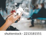 Small photo of Selective focus at women hand holding mobile smartphone to activate global data roaming package or surfing for internet connection while travel in the airport with futuristic icon.