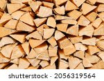 A Woodpile Of Firewood Lies In...