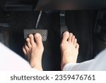 Drive barefoot  the feet of a...