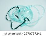 Small photo of Close-up of an oxygen mask. a simple face mask is given to patients who need oxygen with an oxygen level of 40-60%