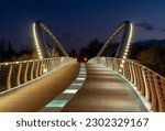 Scenic photo about the illuminated bridge in Szolnok city Hungary. This bridge is over the Tisza river. The name is Tisza-flower bridge. Hungarian name is tiszavirag hid.