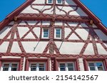 Close up of gable wall of old house with ornate half-timbering in southern Germany