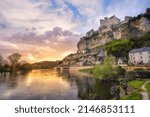Small photo of Beynac-et-Cazenac village with medieval Chateau Beynac on dramatic sunset, Dordogne, France. Beynac is famous as one of the most beautiful villages of France (les plus beaux villages de France)