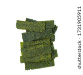 Small photo of Close-up of Crispy dried seaweed, Nori chips piece of roasted seaweed sheet isolated on white background, macro or close-up Healthy food concept, flat lay roasted seaweed