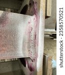 Small photo of Liquid penetrant exams check for material flaws open to the surface by flowing very thin liquid into the flaw and then drawing the liquid out with a chalk-like developer.