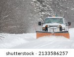 A Snowplow Clearing A Rural...