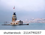 Small photo of Magnific view of Maiden's Tower (aka Kiz kulesi) in winter day with many snow in Istanbul,Turkey. Istanbul's main attractions.