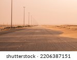 Roads are covered with desert sand during sand storm. Sand storm road block. Desert road blockage. Sand moving from one end of the road to other end and get accumulate. 