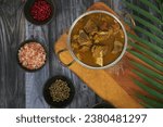Small photo of Indian cuisine, Spicy and delicious mutton curry in traditional pot. Tasty mutton curry with Indian spices .Mutton masala. Best for rice and chapati.
