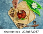 Small photo of Famous lamb recipe called Mutton Rogan josh or lamb rogan josh,Indian mutton curry prepared with spices and served with plain rice, chapati, roti