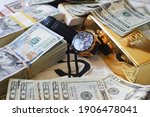 Small photo of Financial Abundance Affluence With Stacks Of Cash With Luxury Watch Gold Bar