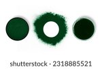 Small photo of Spirulina powder. Spirulina diluted in water. Spirulina solution in a petri dish. Scattered powder in the form of a circle. Spirulina, superfood, bioadditive. Green. Eco