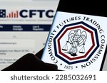 Small photo of Commodity Futures Trading Commission CFTC logo seen on the screen of smartphone hold in hands in dark. Stafford, United Kingdom, April 3, 2023.