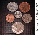 Small photo of Staines, Surrey / UK - April 02 2018: A collection of 1p 2p 5p 10p 20p and 50p coins facing tails up and arranged to form the british coat of arms.