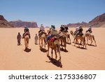 Small photo of Trip on camels on Wadi Rum Desert in Jordan. The amazing Wadi Rum desert with Martian scenery.