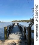 Small photo of Fishing pier with view of Tucker Bayou at Eden Gardens State Park Florida February 2024