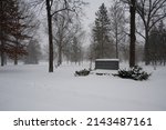 Small photo of OBERLIN, OHIO, USA - JANUARY 02, 2014: Sign marks the entrance to Westwood Cemetary on Morgan Street, during a snowstorm.