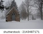 Small photo of OBERLIN, OHIO, USA - JANUARY 02, 2014: A chapel building in Westwood Cemetary on Morgan Street, during a snowstorm.