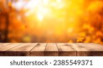 Small photo of The empty rustic wooden table for product display with blur background of autumn forest. Exuberant image. background of autumn landscape. Concept Autumn nature and product advertising. copy space.