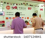 Small photo of CHINATOWN, SINGAPORE â€“ 26 DEC 2019 â€“ View of Chinese nationals at the counter of a money transfer remittance company. Chinese words read "ZHONGGUO REMITTANCE"