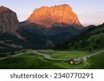 Serpentine in the Italian Alps mountains. Gardena pass,Passo Gardena, Rifugio Frara, Dolomiti, Dolomites, South Tyrol, Italy, UNESCO World Heritage. Aerial amazing shot. View from above.