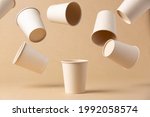 many recyclable cardboard cups floating on a kraft cardboard bottom