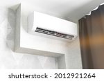 Air conditioner system on white wall living room interior, modern design concept background