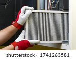 Replacing the filter in the central ventilation system. Replacing Dirty Air filter for home central air conditioning system. Change filter in rotary heat exchanger recuperator.