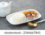 Small photo of Crispy dory fillets (Ikan dori goreng tepung) with chilli sauce