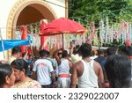 Small photo of Mahesh, 06-28-2023: priests chanting in the name of God as they carry idol of Lord Jagannath (wrapped in red blanket) through heavy crowd, from Gundicha Bari temple to the chariot.
