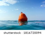 Orange Buoy In The Waves Of The ...