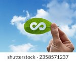 Small photo of Hand of human is holding green leaf with circular economy icon, eternity endless and unlimited of energy for business model for environment sustainable concept.