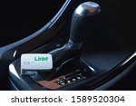 Small photo of QUAKERS HILL, NSW / AUSTRALIA - AUGUST 12, 2019: Linkt Car tag placed on automatic tiptronic gear stick