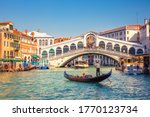Gondola on Grand canal near Rialto bridgein Venice, Italy